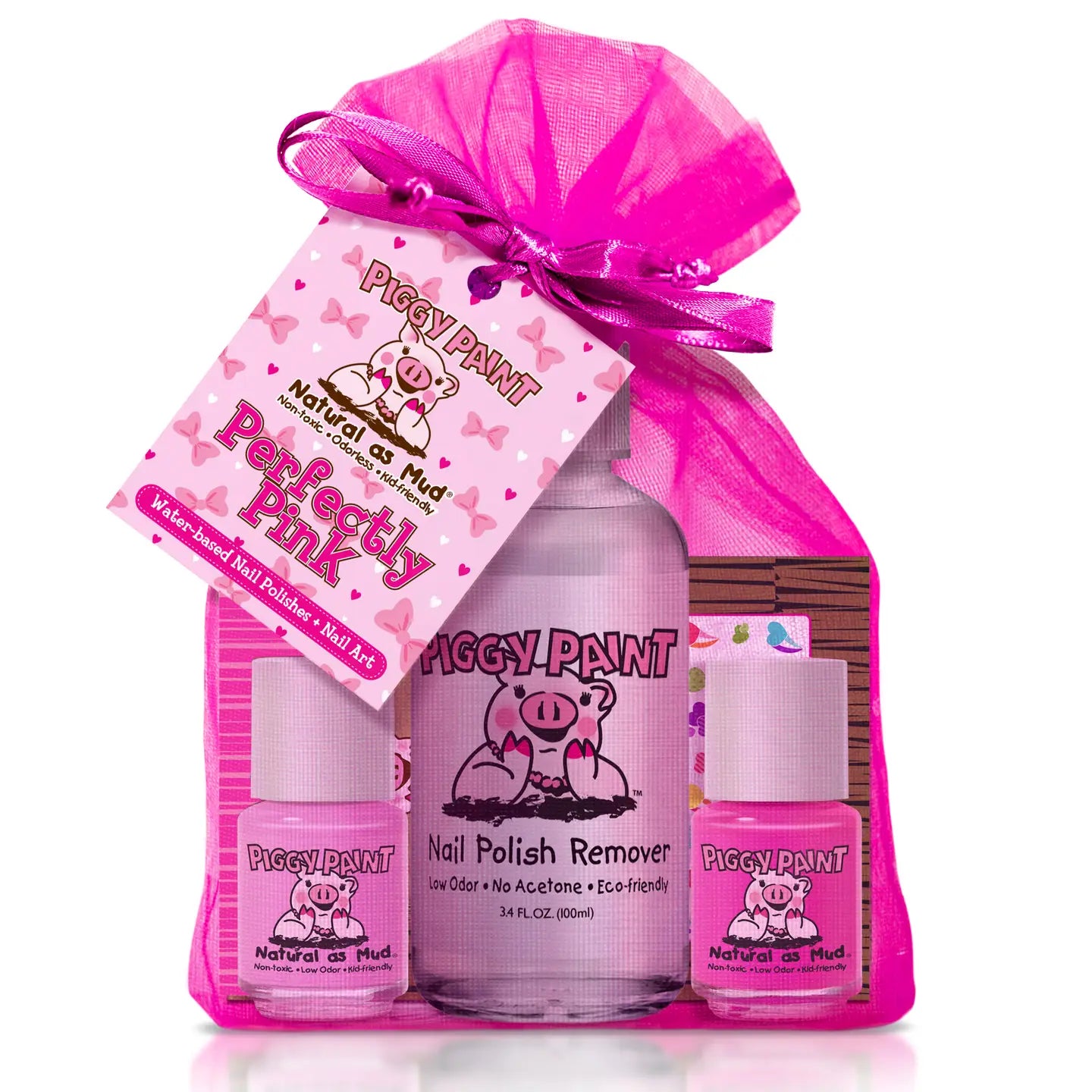 Piggy Paint nail care product set with pink packaging and ribbons on a white background