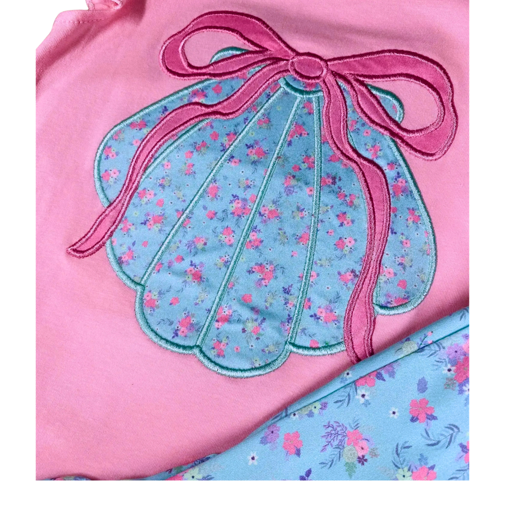 Pink and blue fabric with floral design and bow detail