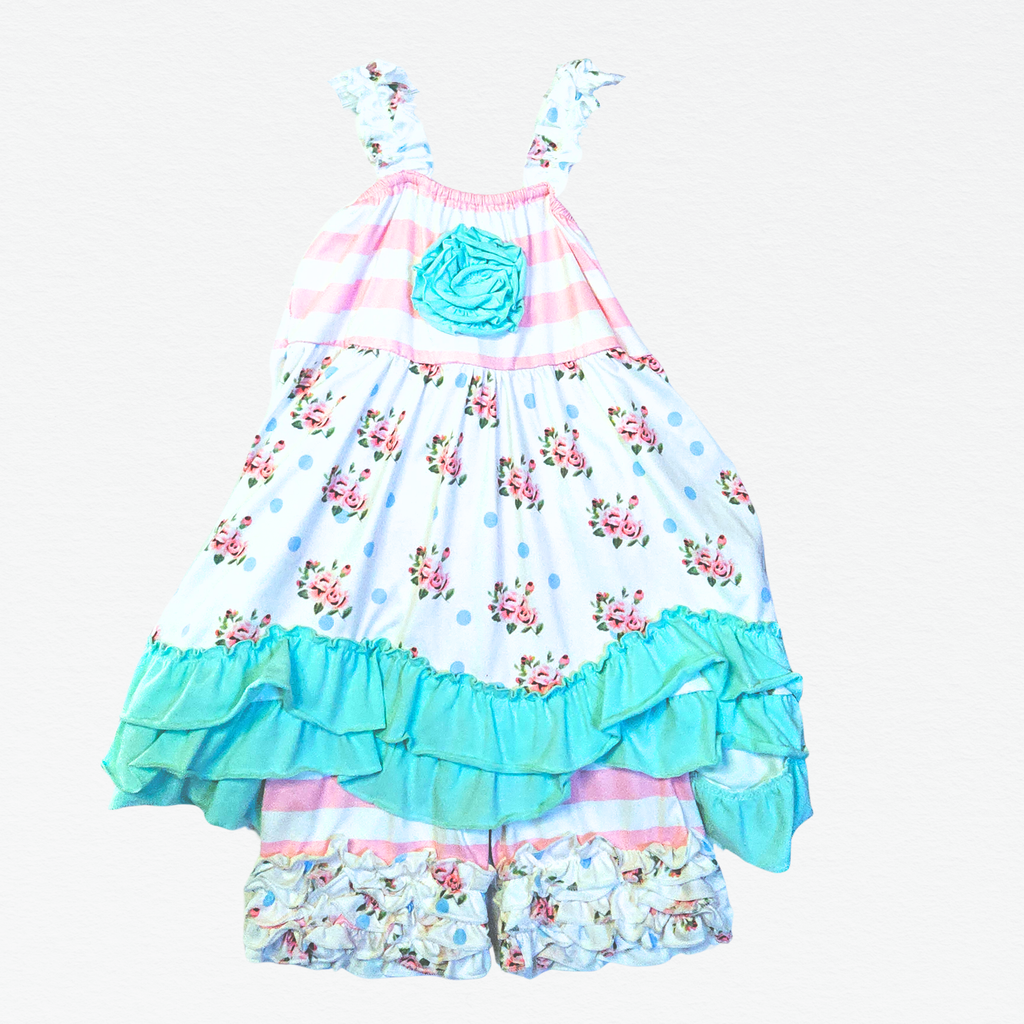 Floral dress with ruffled layers on a white background