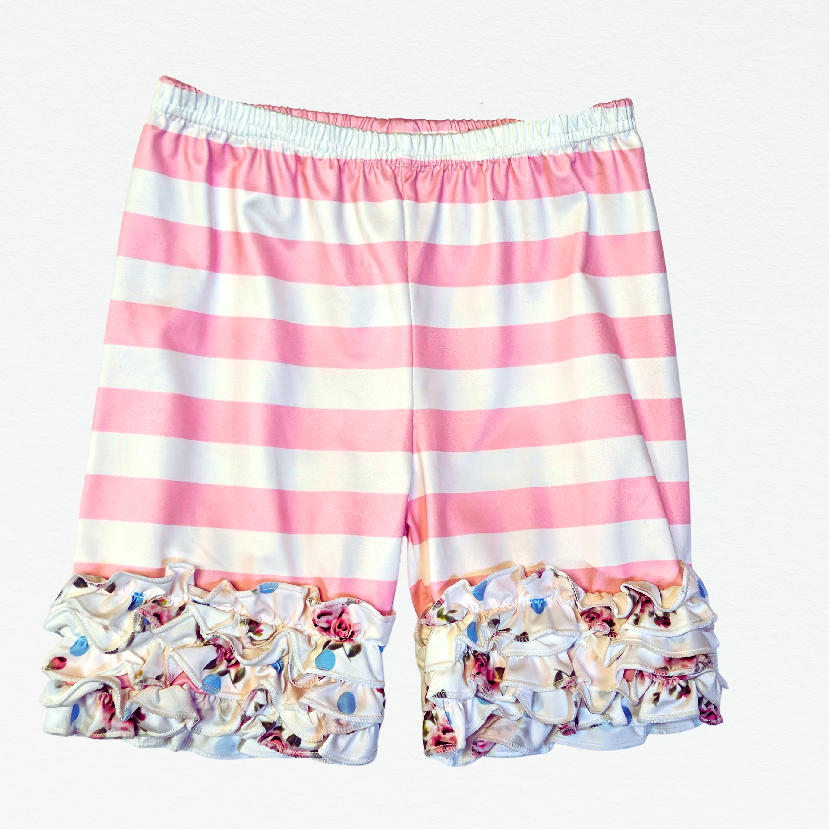 Pink and white striped shorts with floral ruffle trim on a white background