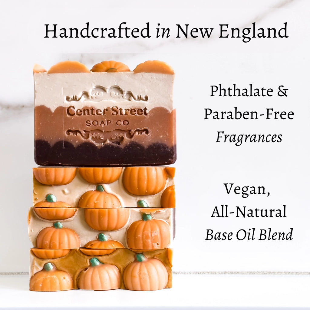 Two soap bars, one with 'Center Street Soap Co' branding and the other with pumpkin design, on a white background.