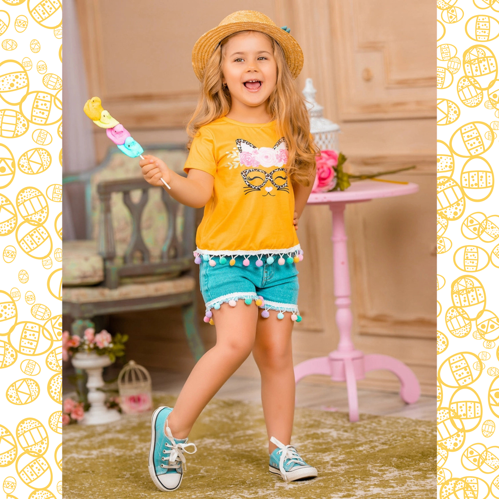 Child wearing a yellow shirt and blue shorts, holding a colorful popsicle, with a decorative border.
