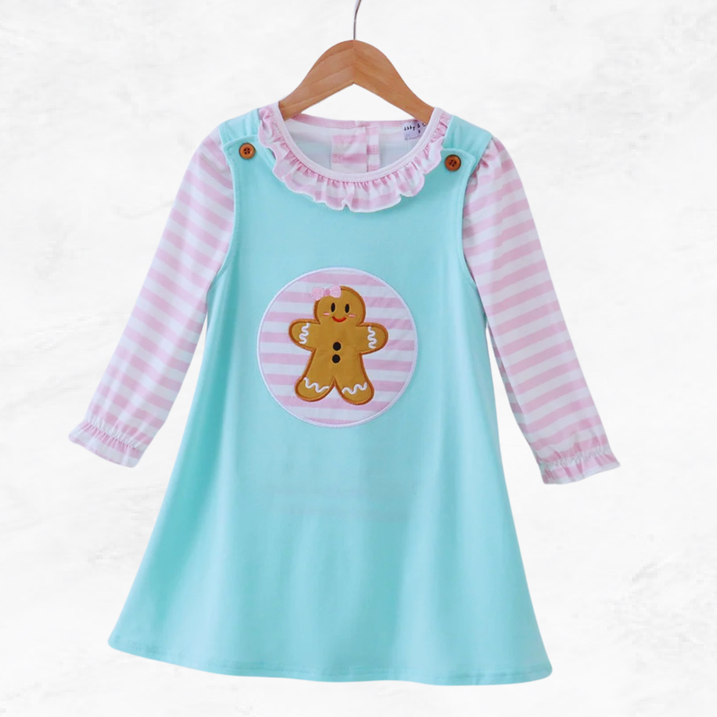 Children's dress with gingerbread design on a white background