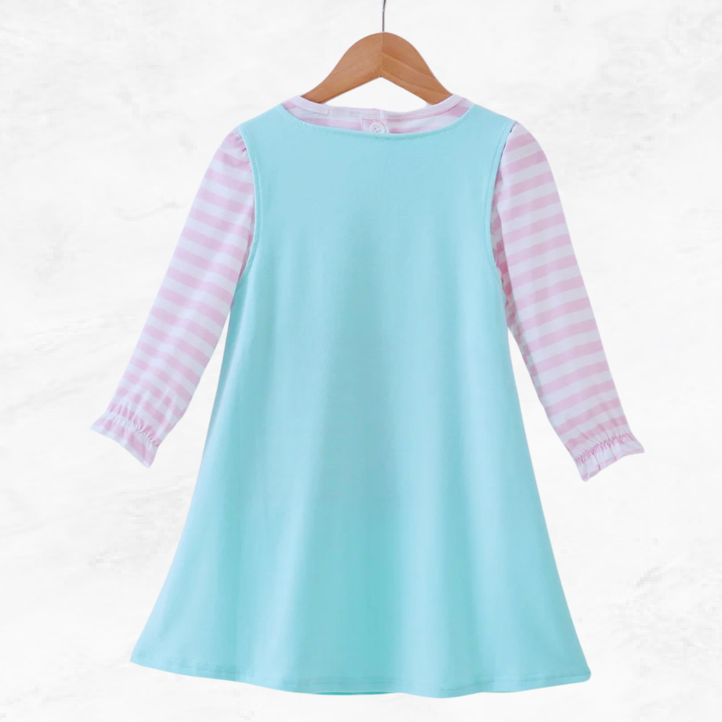 Light blue dress with pink striped sleeves on a wooden hanger against a white background