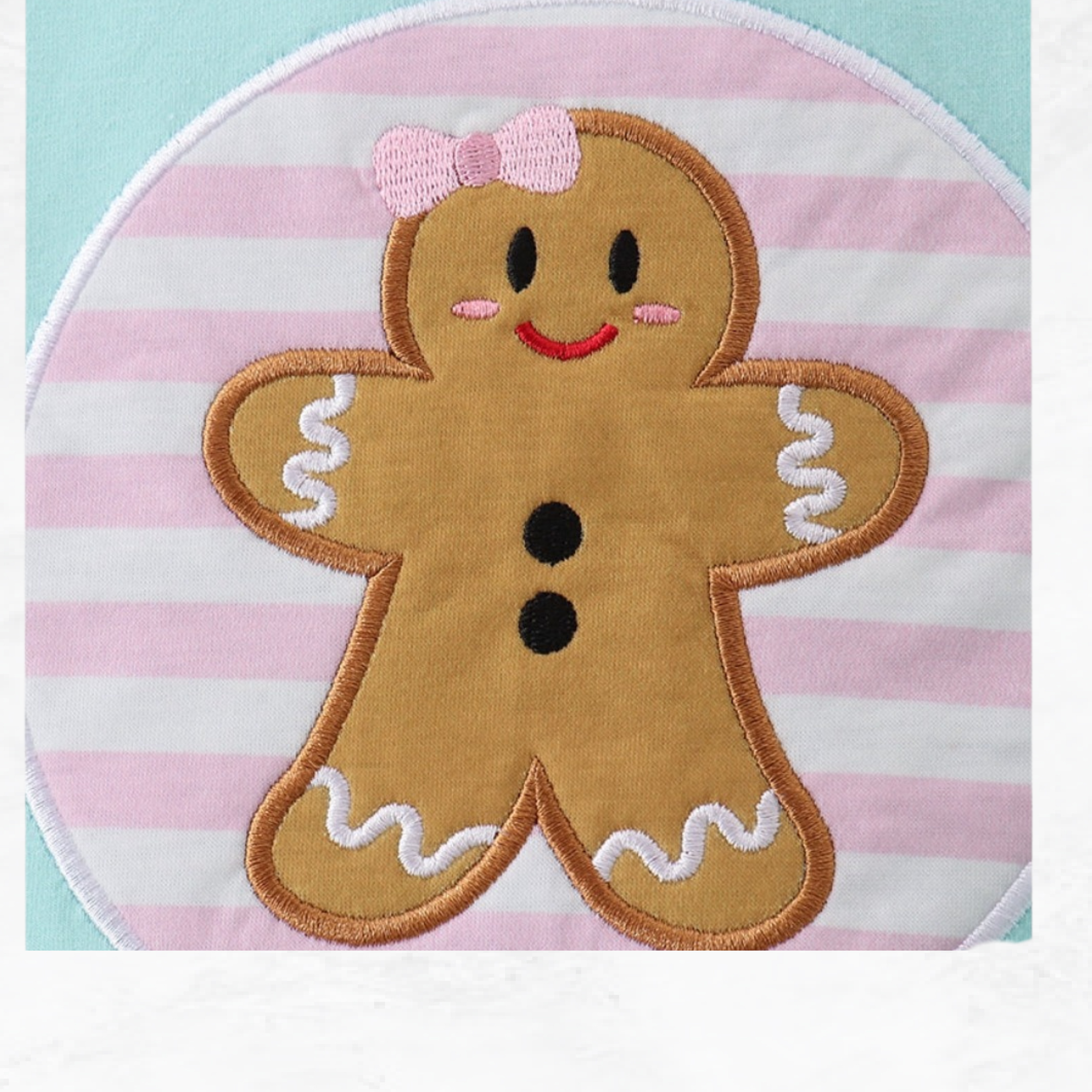 Gingerbread man patch with a bow on a pink and white striped background