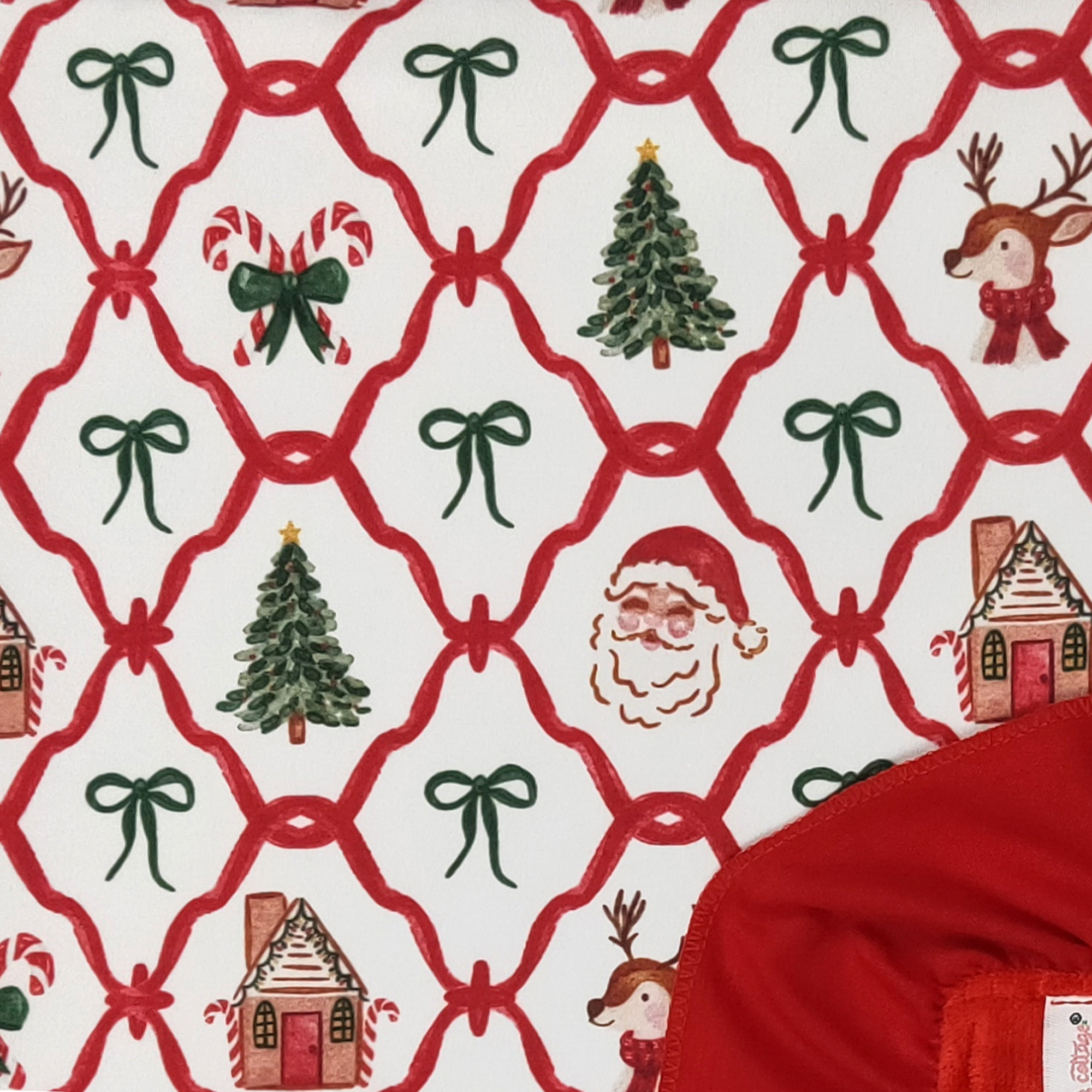 Christmas-themed fabric with Santa Claus, trees, and houses on a white background.