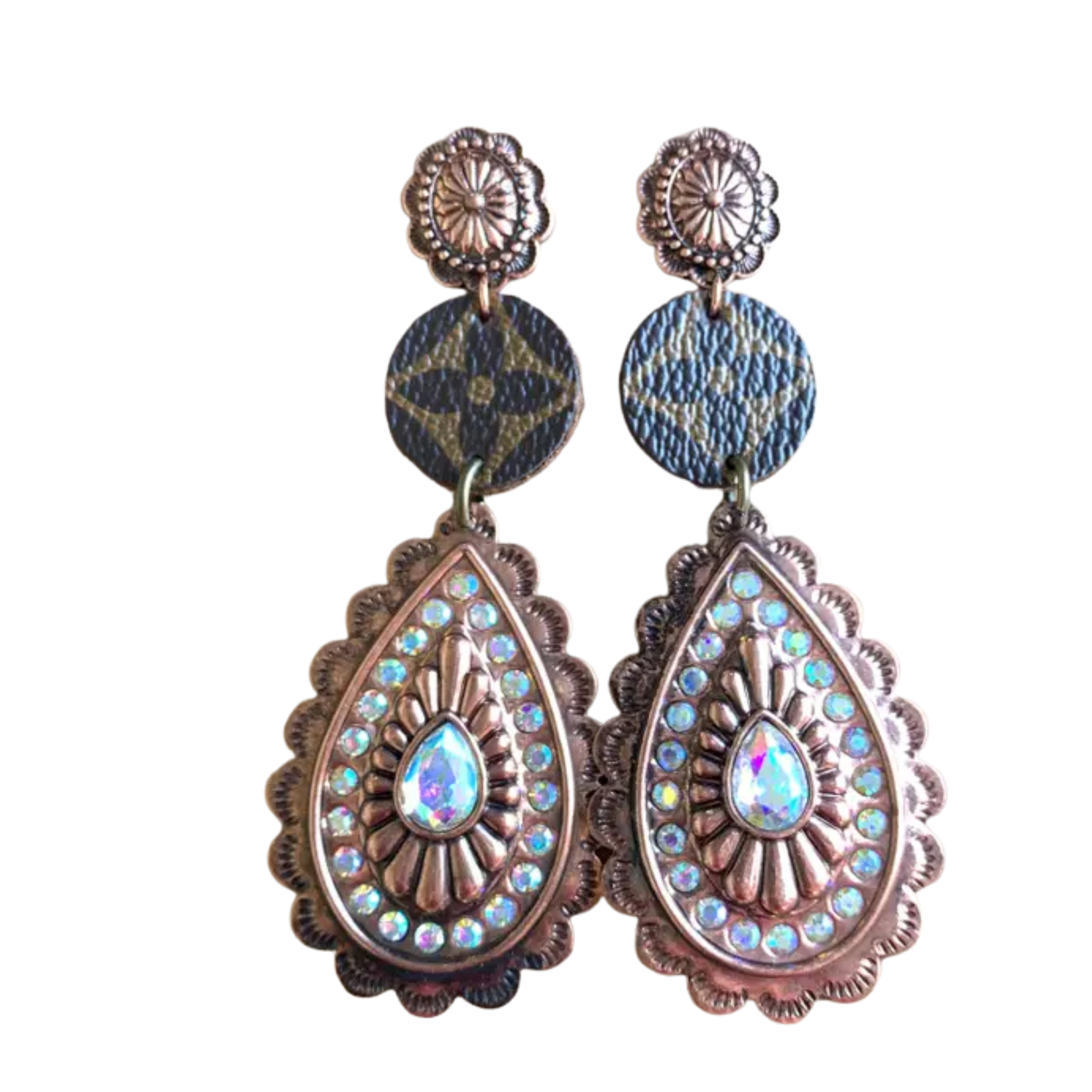 Pair of decorative earrings with teardrop shapes and embellishments on a white background