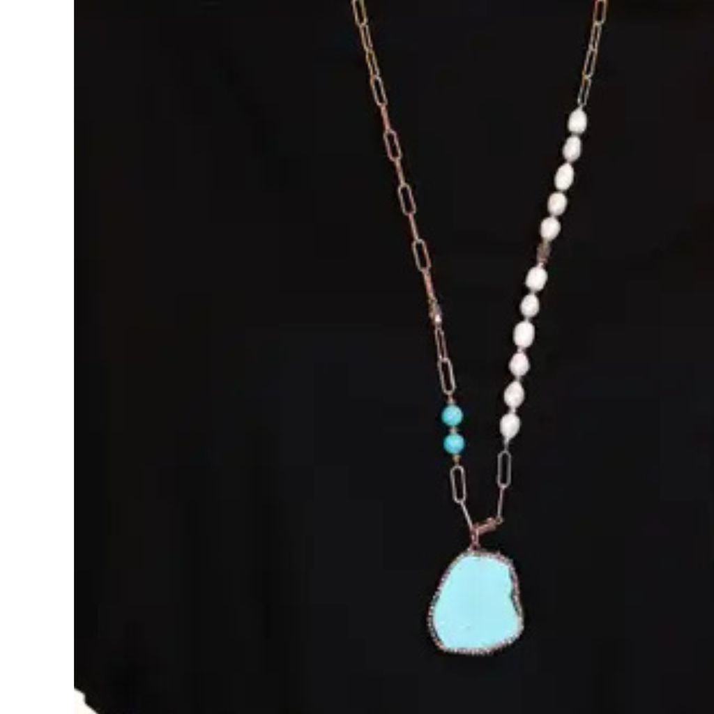 Necklace with turquoise pendant and white beads on a black background