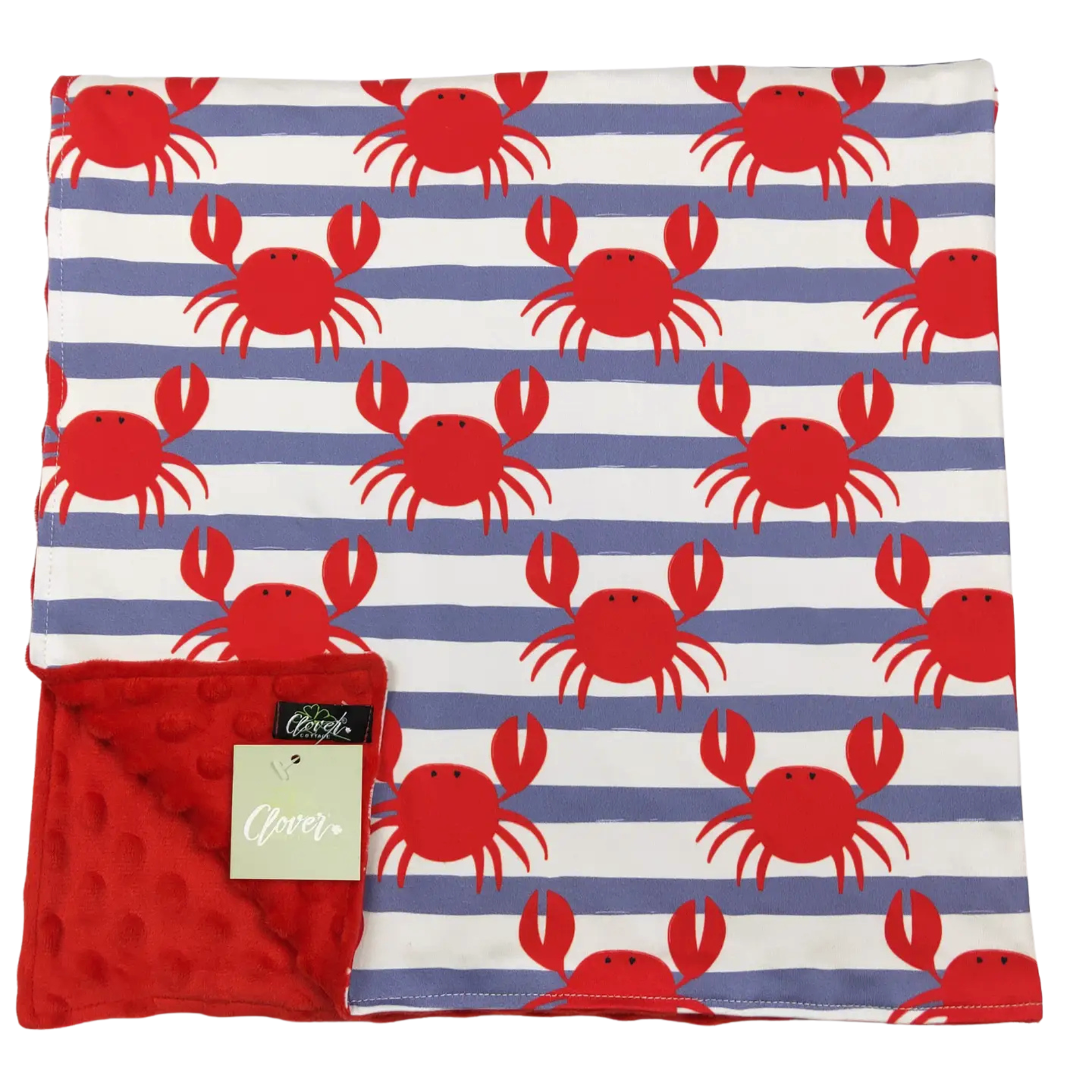Blanket with red crab pattern on white and blue stripes, folded with a tag showing brand name.