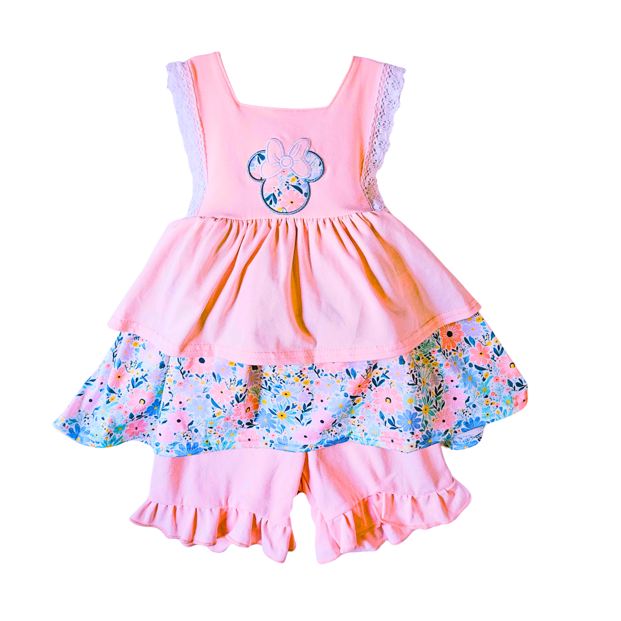 Pink children's dress with floral design on a white background