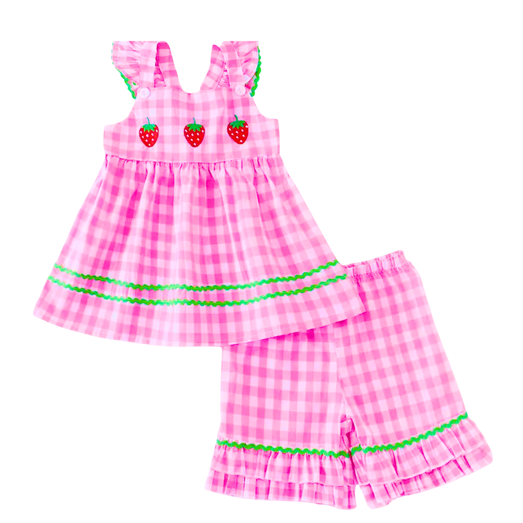 Pink checkered dress and shorts set with strawberry details on a white background