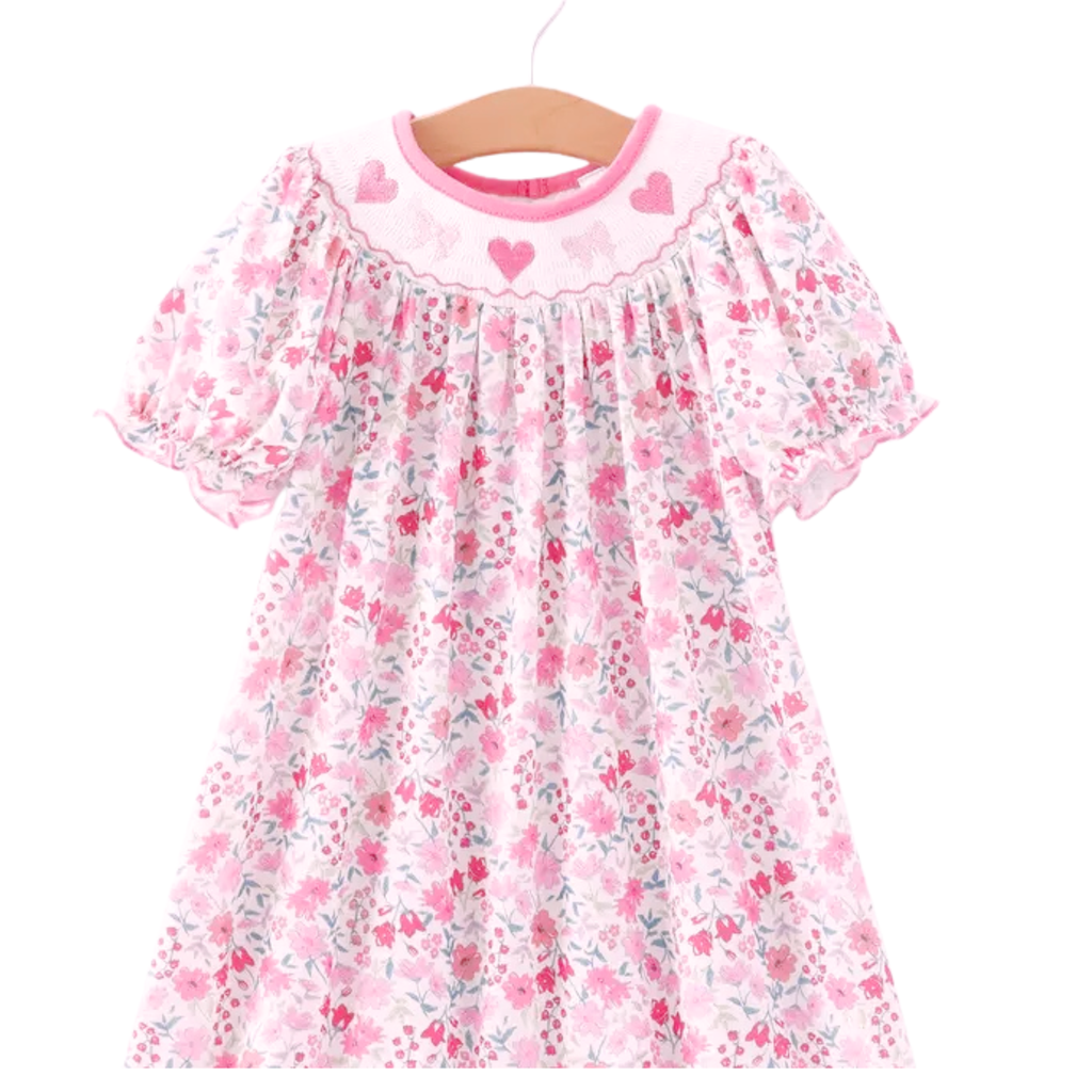 Floral dress with pink accents on a white background