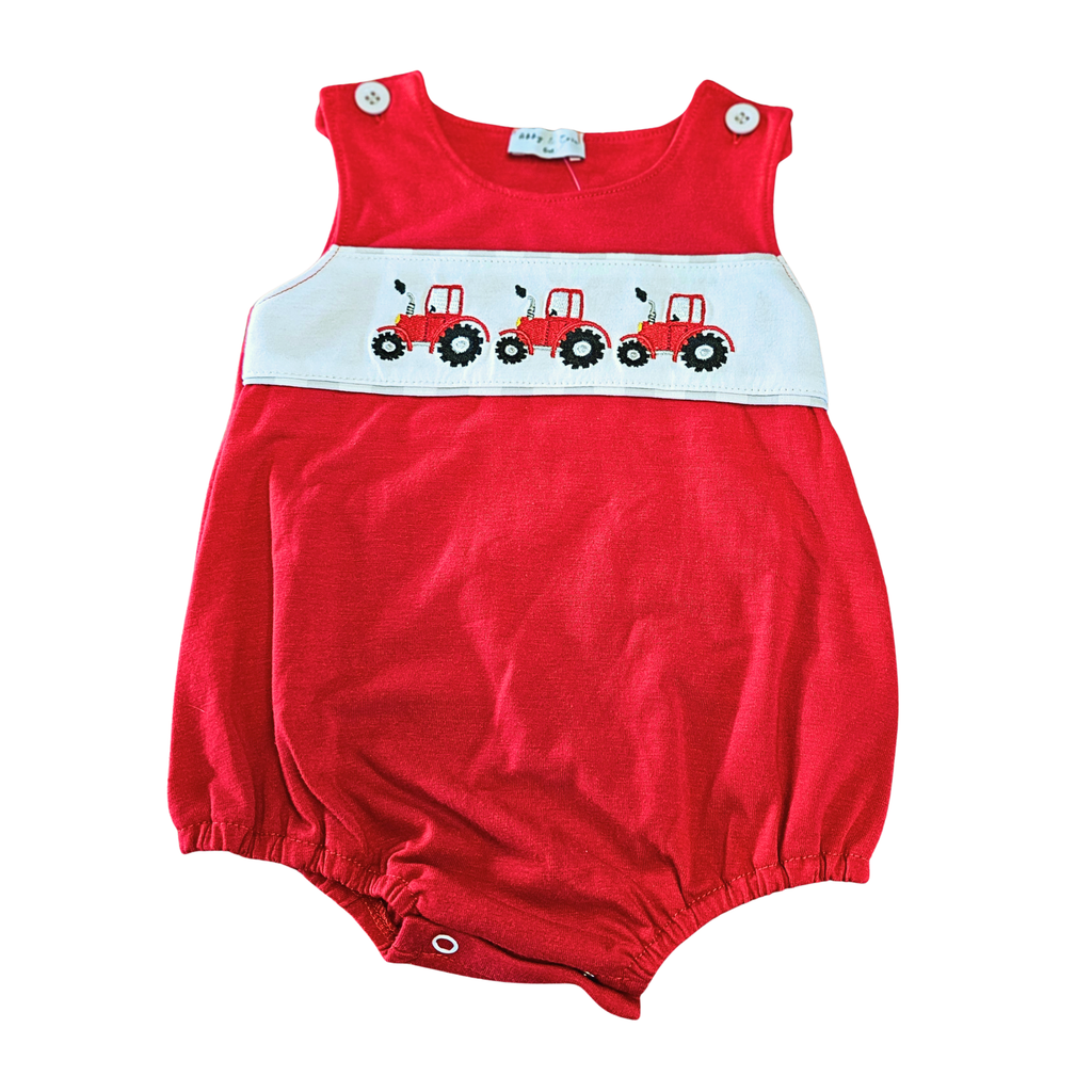 Red baby romper with white waistband featuring red tractors on a white background
