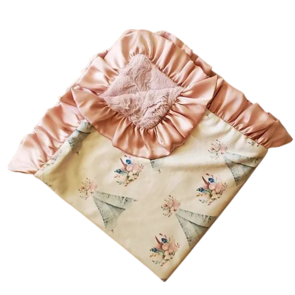 Pink satin bay blanket with Teepee floral designs on a white background