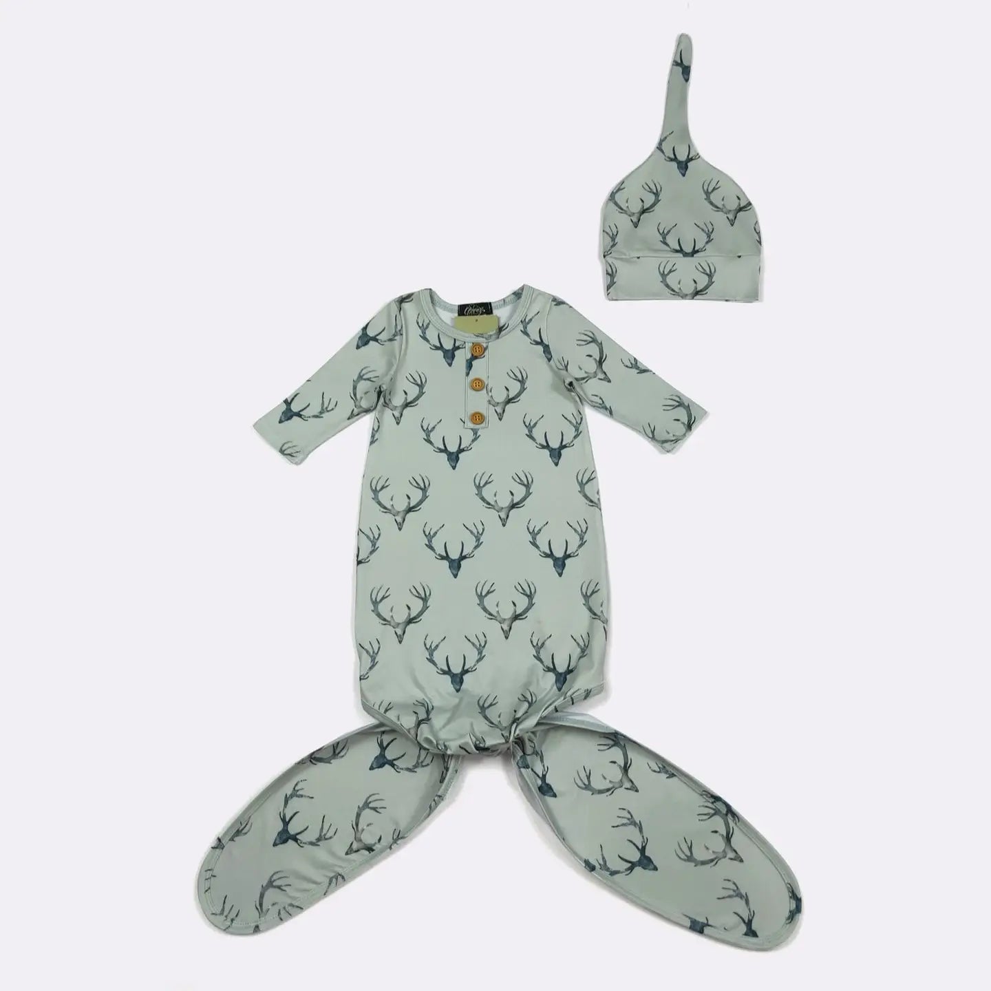 Baby outfit set with green gown and hat featuring deer pattern on a white background
