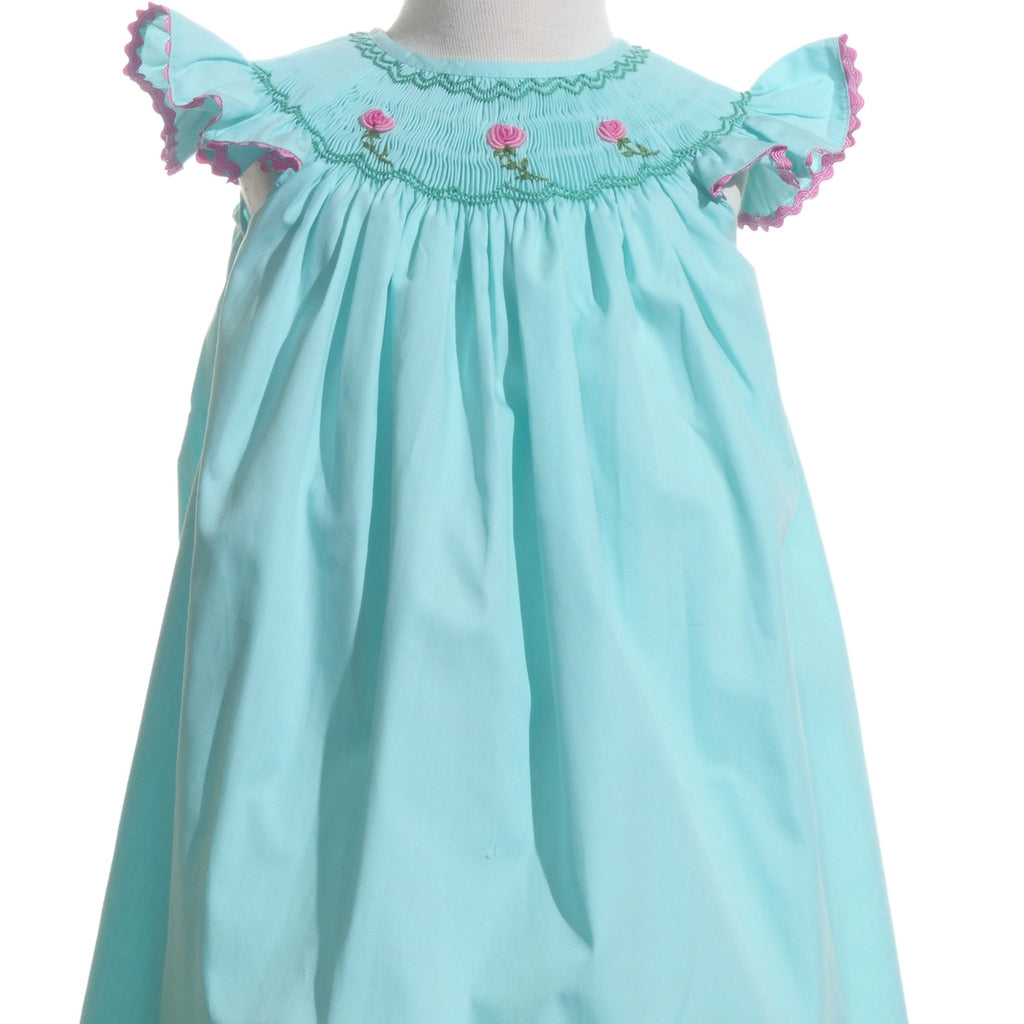 Light blue dress with floral embroidery on a white background