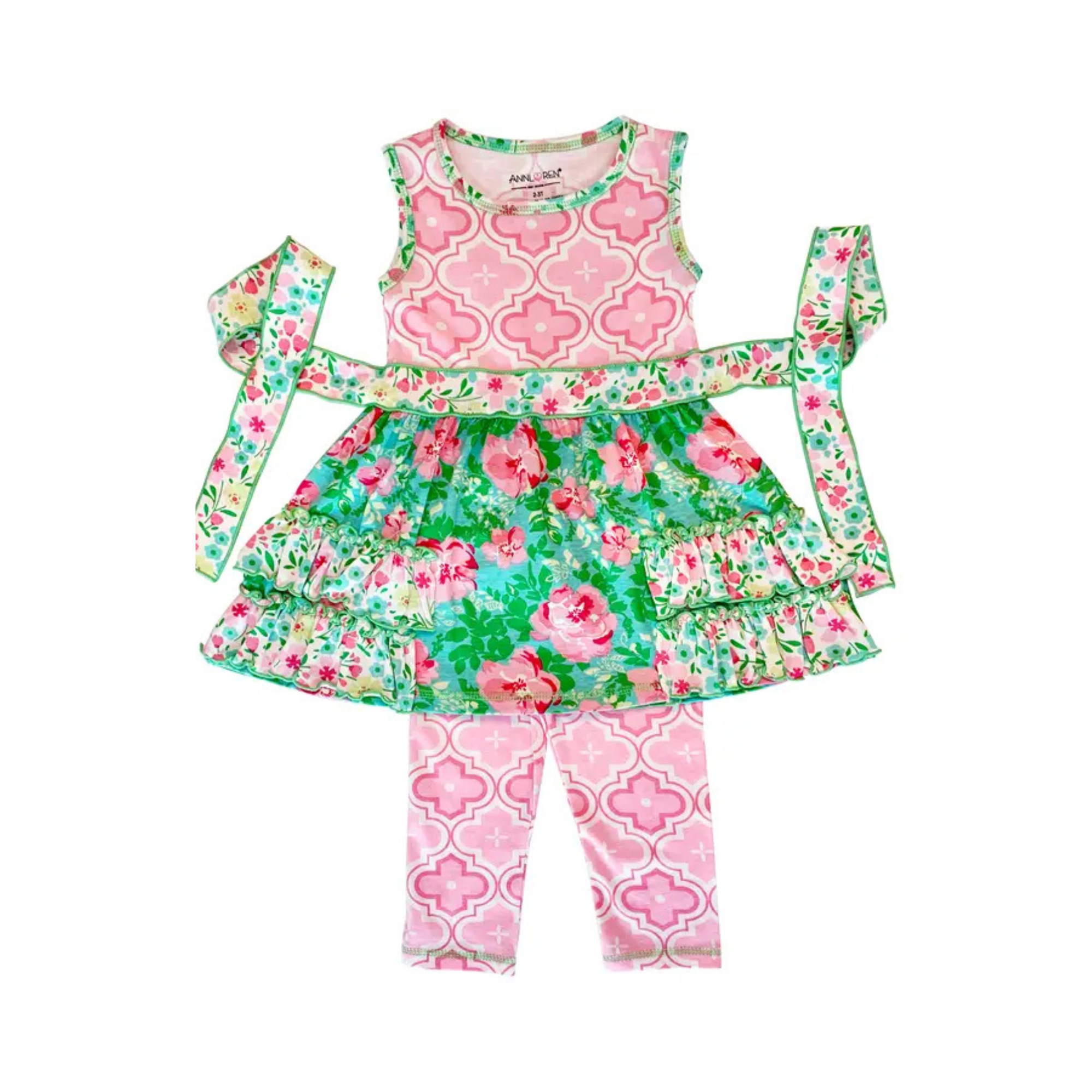 Children's floral outfit with top, skirt, and leggings on a white background