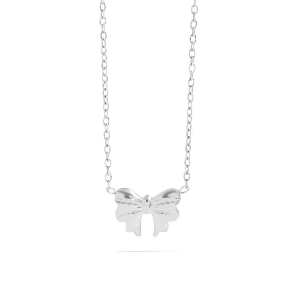 Silver bow-shaped pendant on a chain against a white background