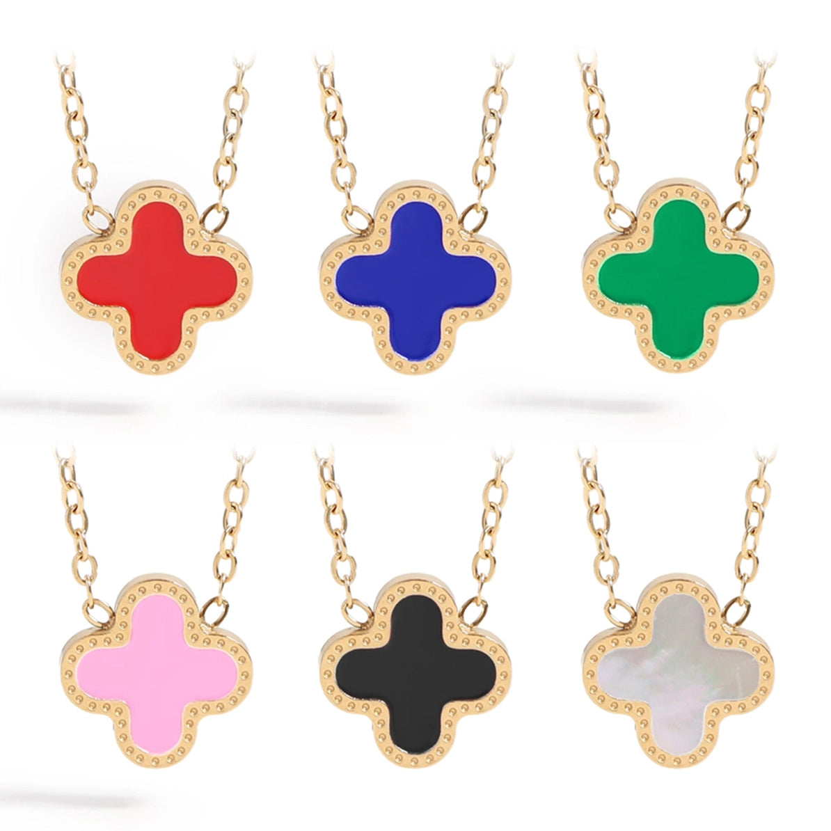 Set of six colorful cross-shaped pendants on gold chains against a white background.