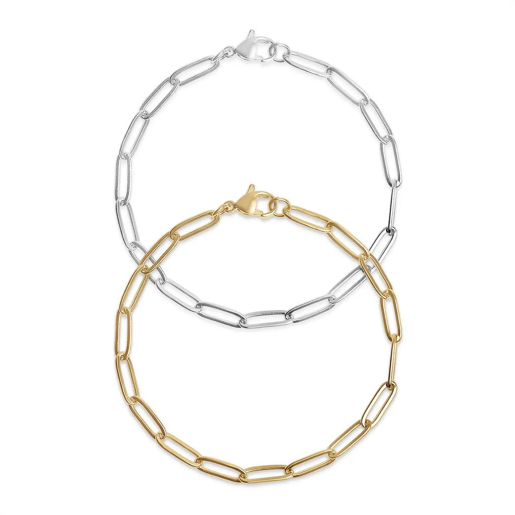 Two chain necklaces, one gold and one silver, on a white background.