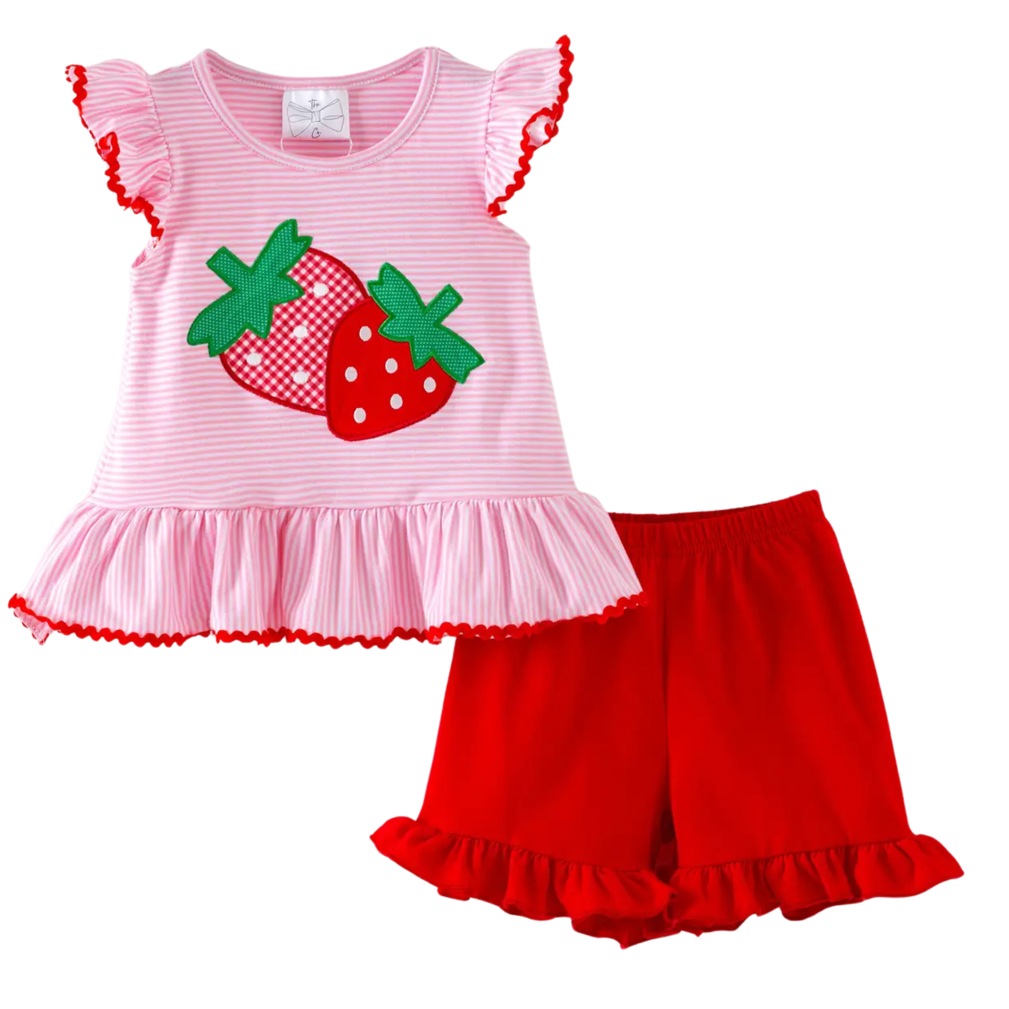 Children's outfit with pink ruffled top and red shorts featuring strawberry design on a white background