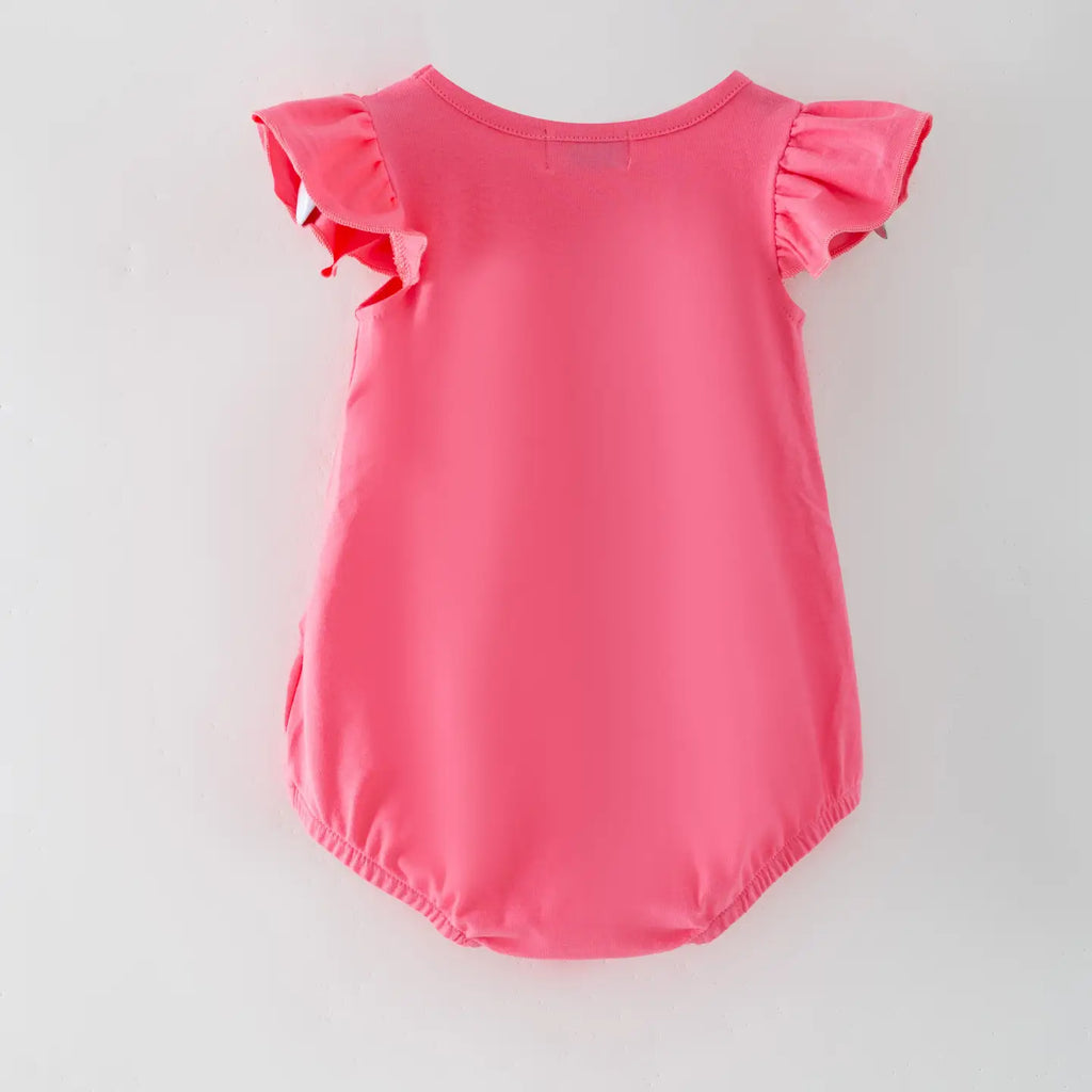 Pink baby romper with ruffled sleeves on a light gray background