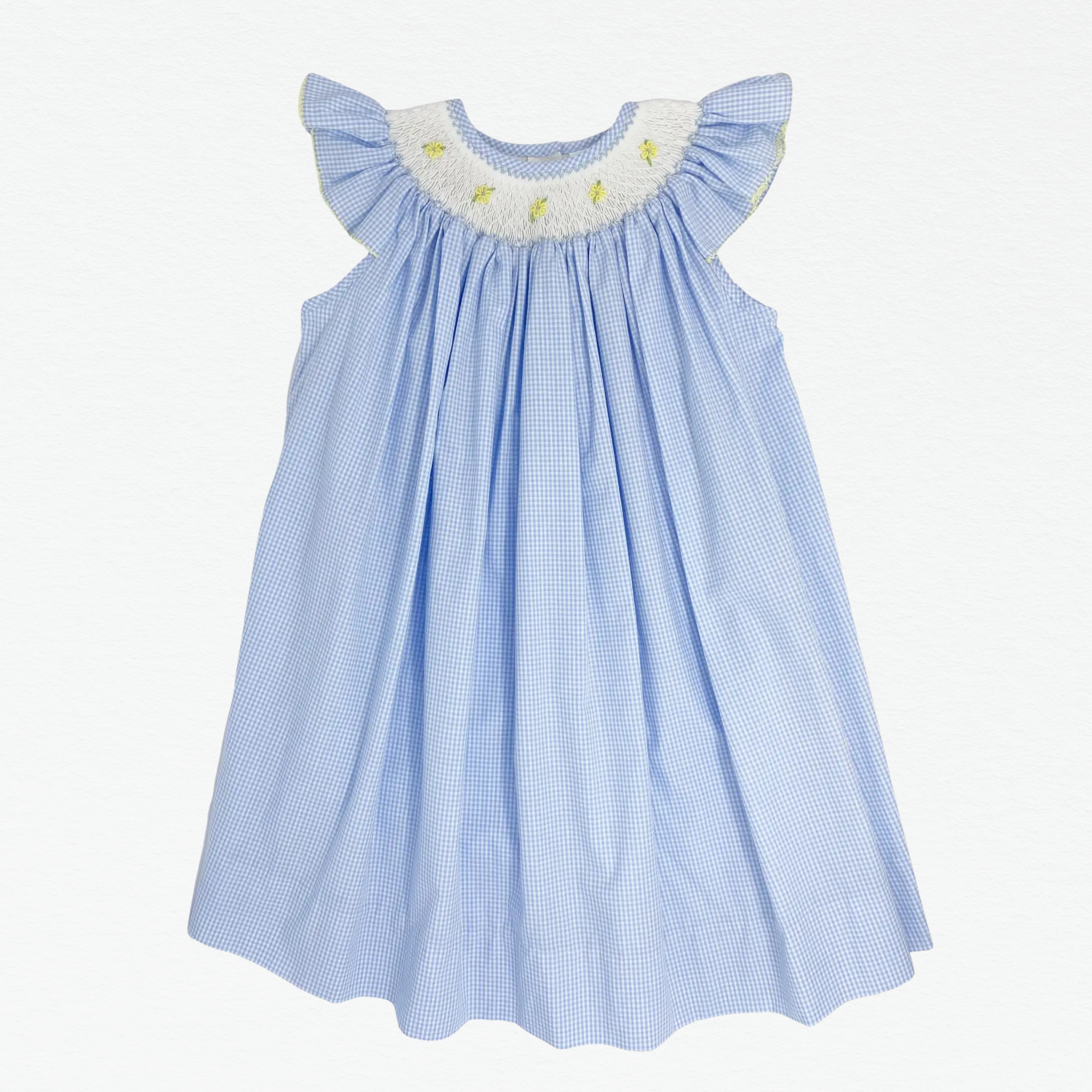 Blue checkered dress with white ruffled neckline on a white background