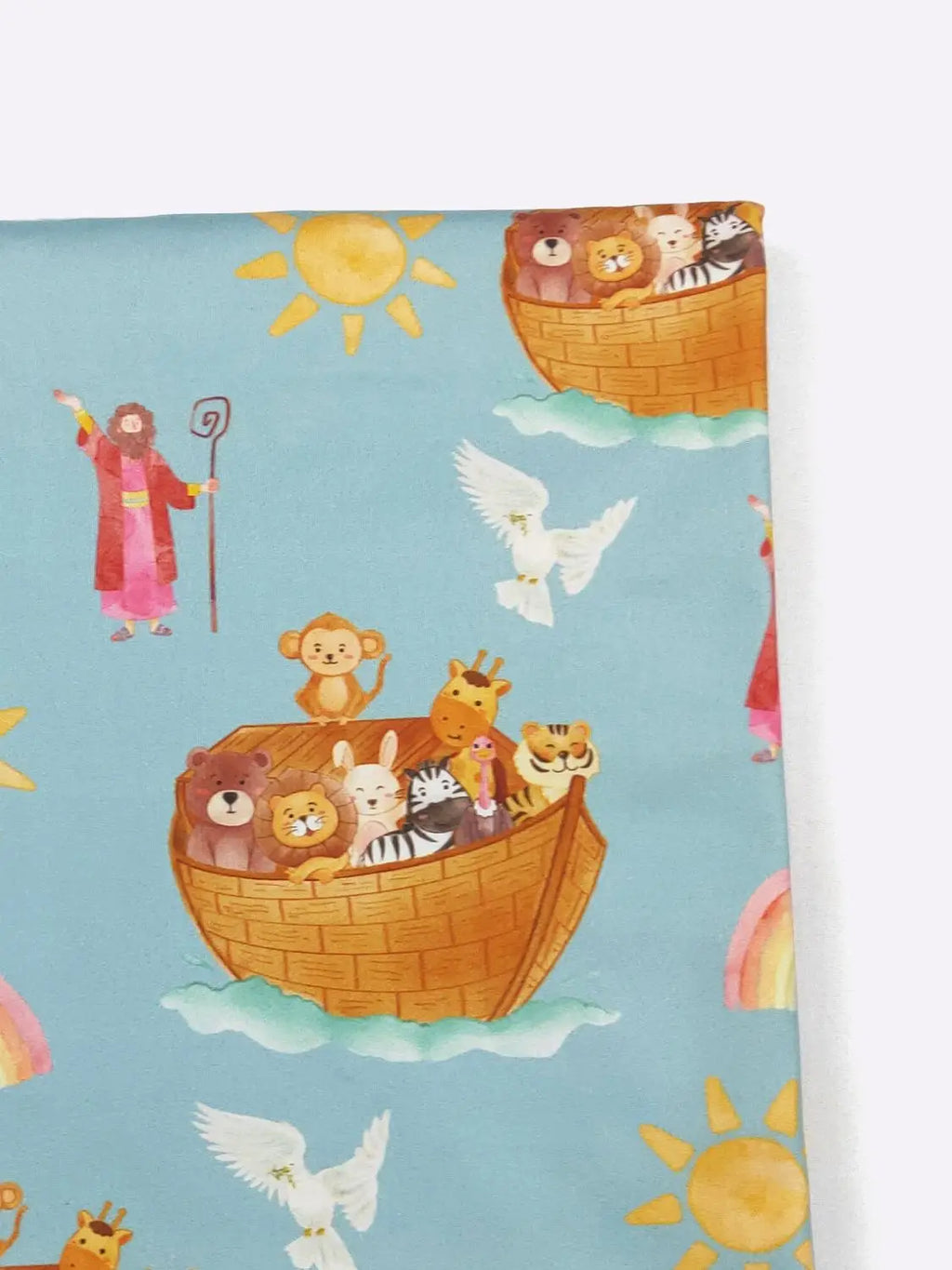 Noah's Ark fabric with colorful illustration of Noah, animals, and a rainbow on a blue background.