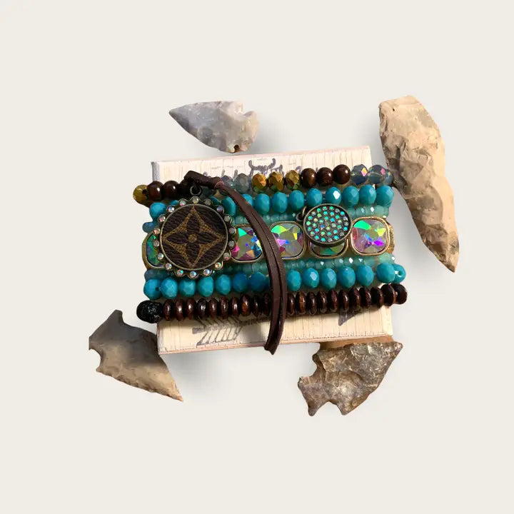 Decorative item with beads and stones on a white background