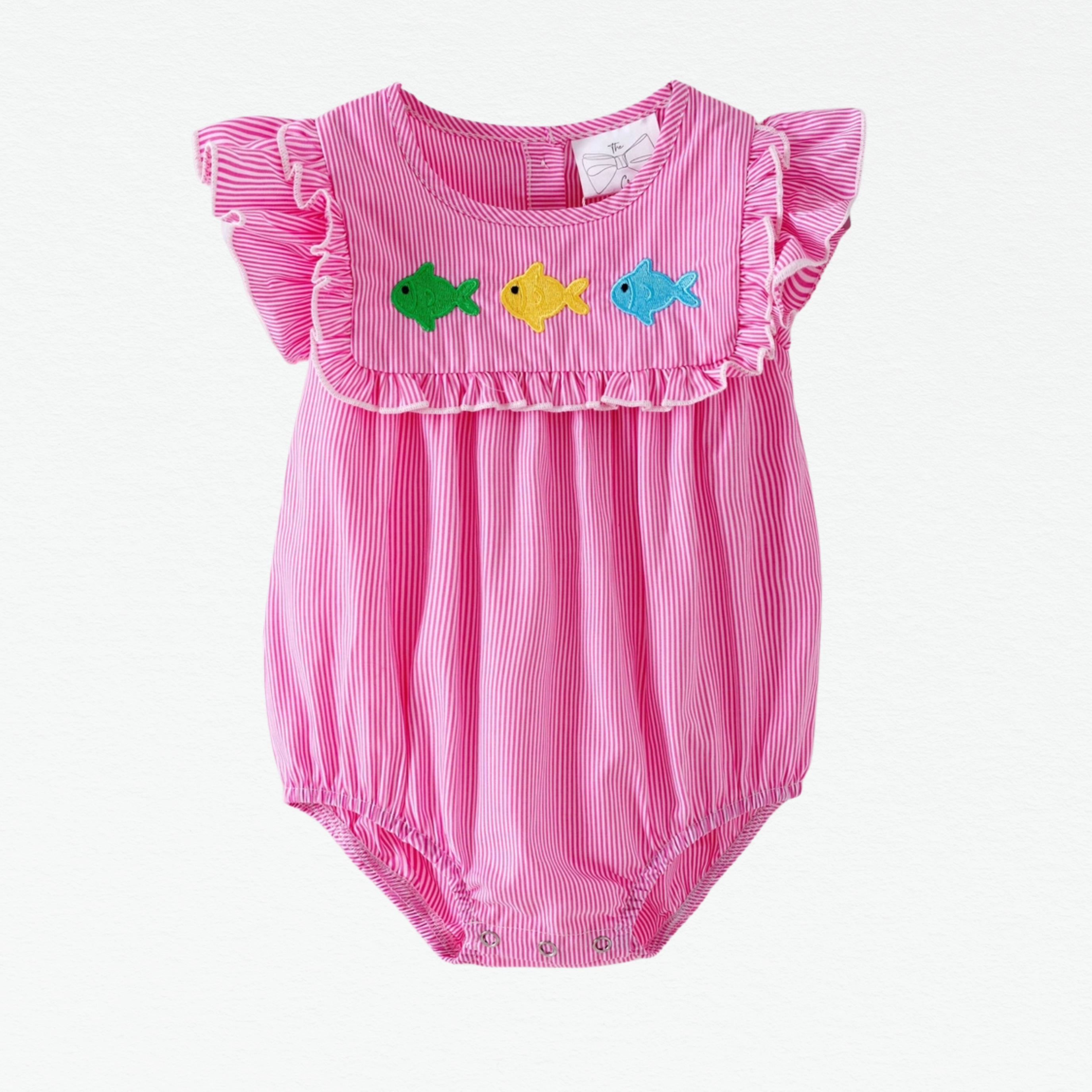 Pink baby romper with ruffled sleeves and fish embroidery on a white background