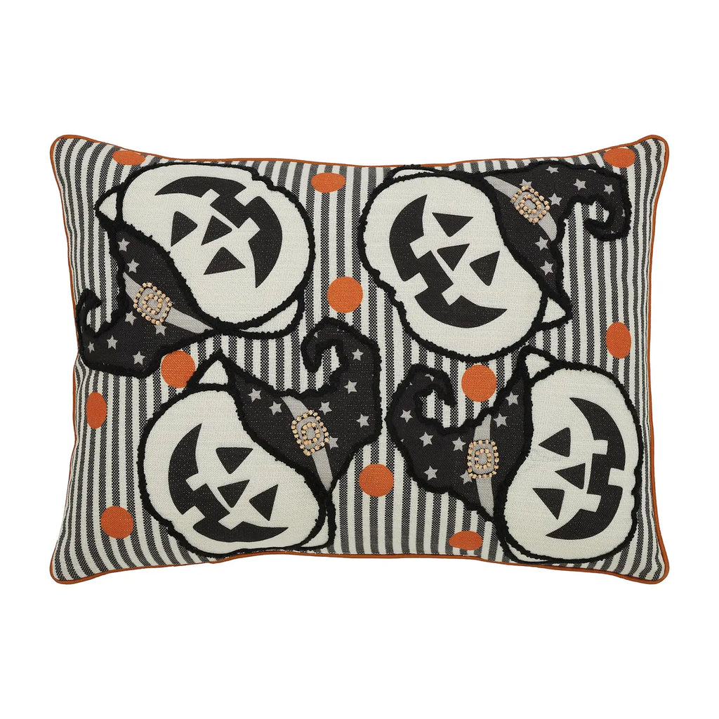 Decorative pillow with Halloween-themed design featuring pumpkins and cats on a striped background.