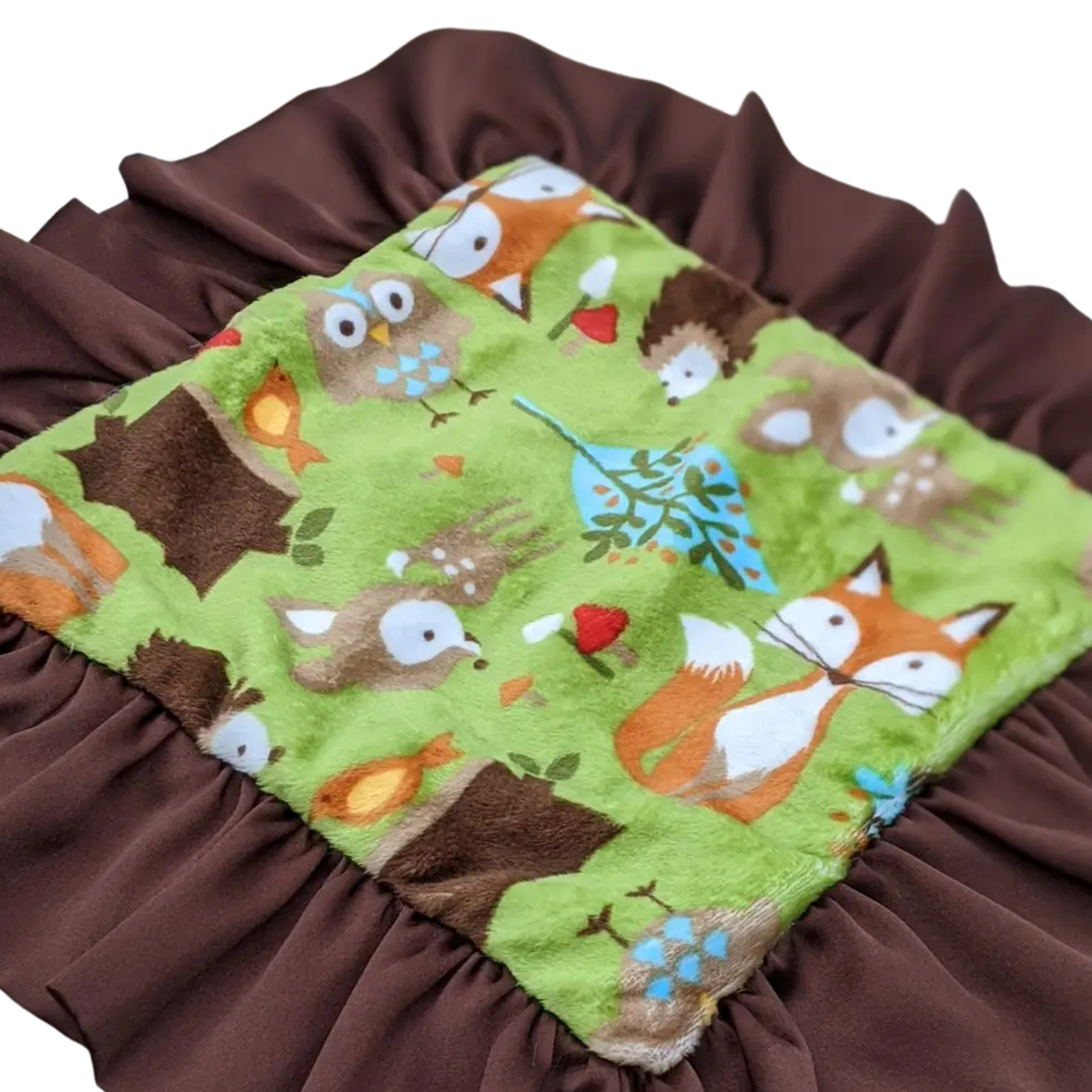 Children's blanket with forest animal pattern on a brown background