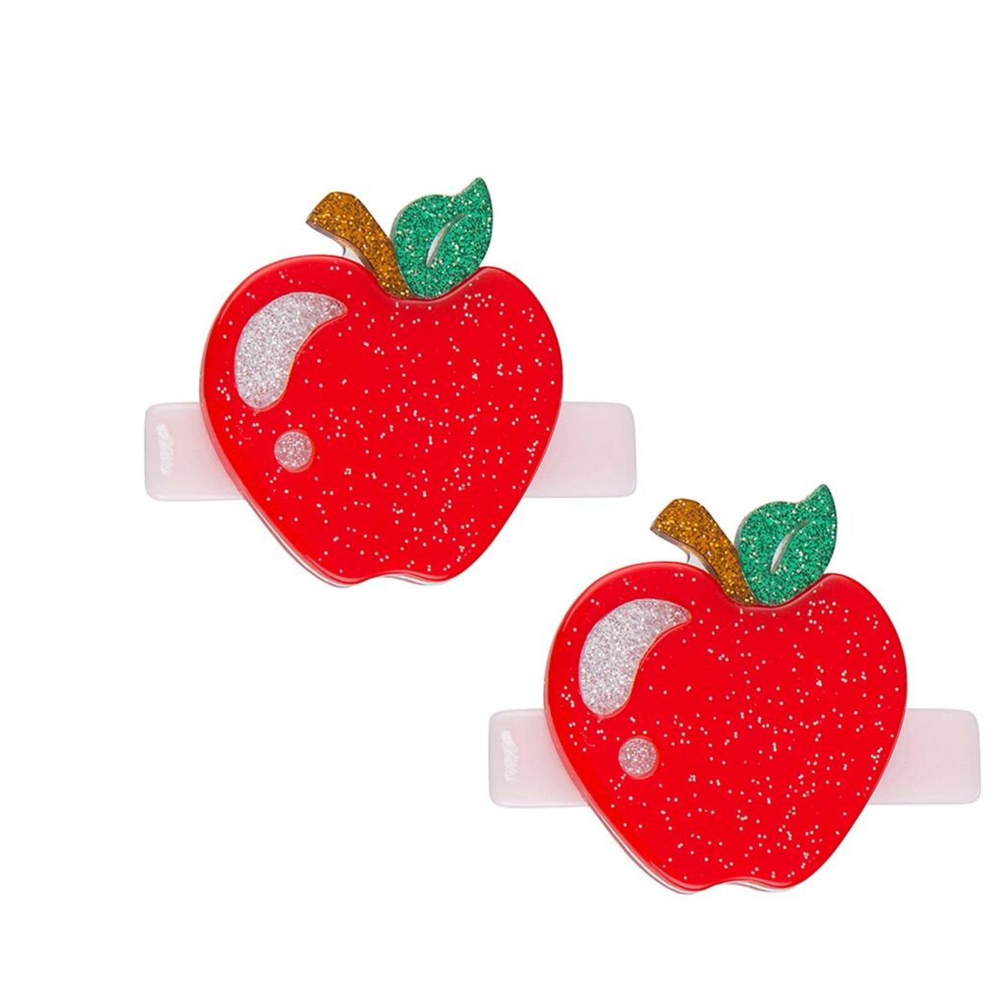 Two red apple-shaped hair clips with glittery texture on a white background