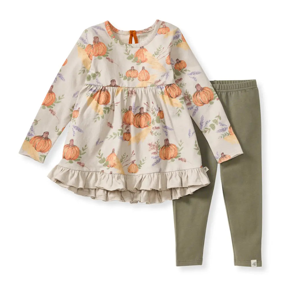 Children's outfit with pumpkin-patterned top and green pants on a white background