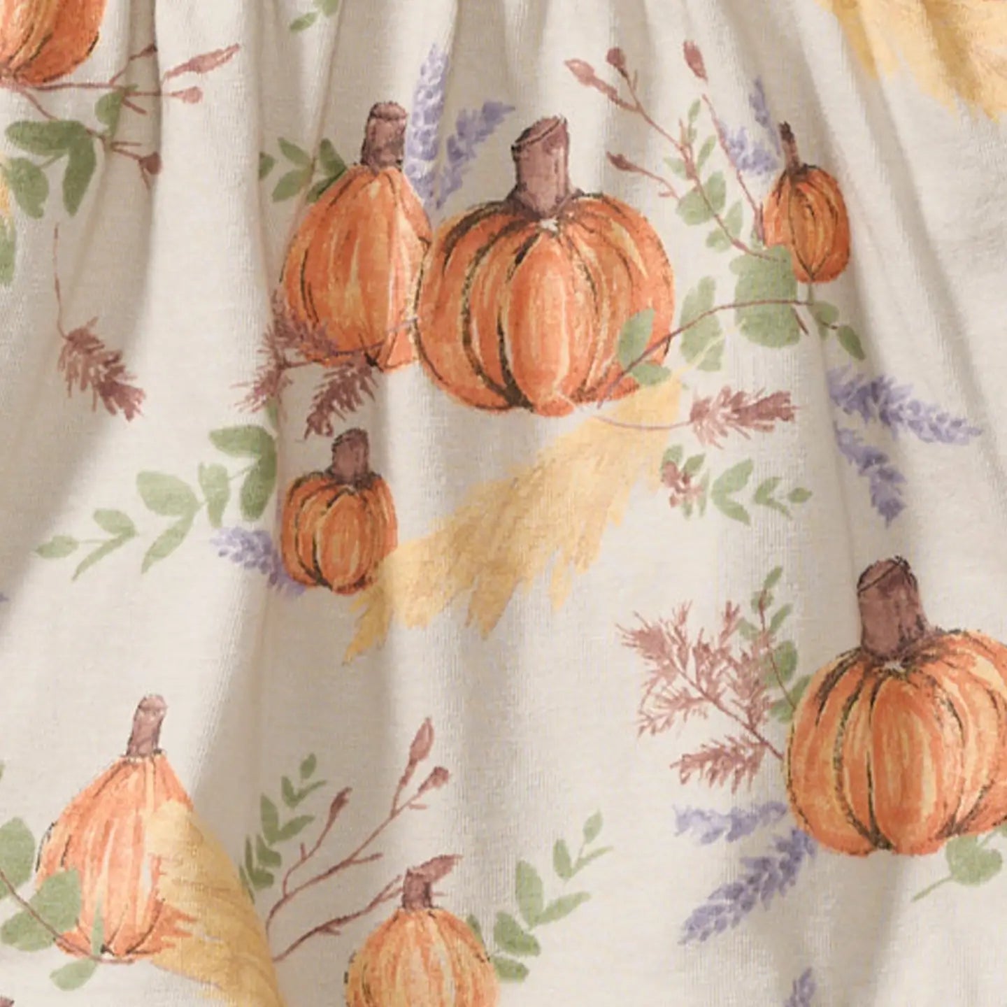 Fabric with pumpkins and floral pattern on a white background