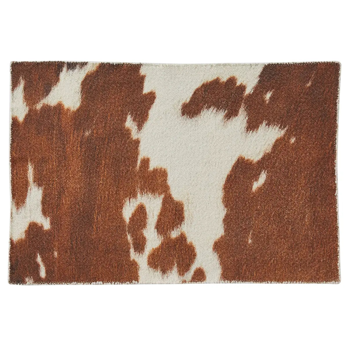 Placemat with brown and white cow print pattern on a white background
