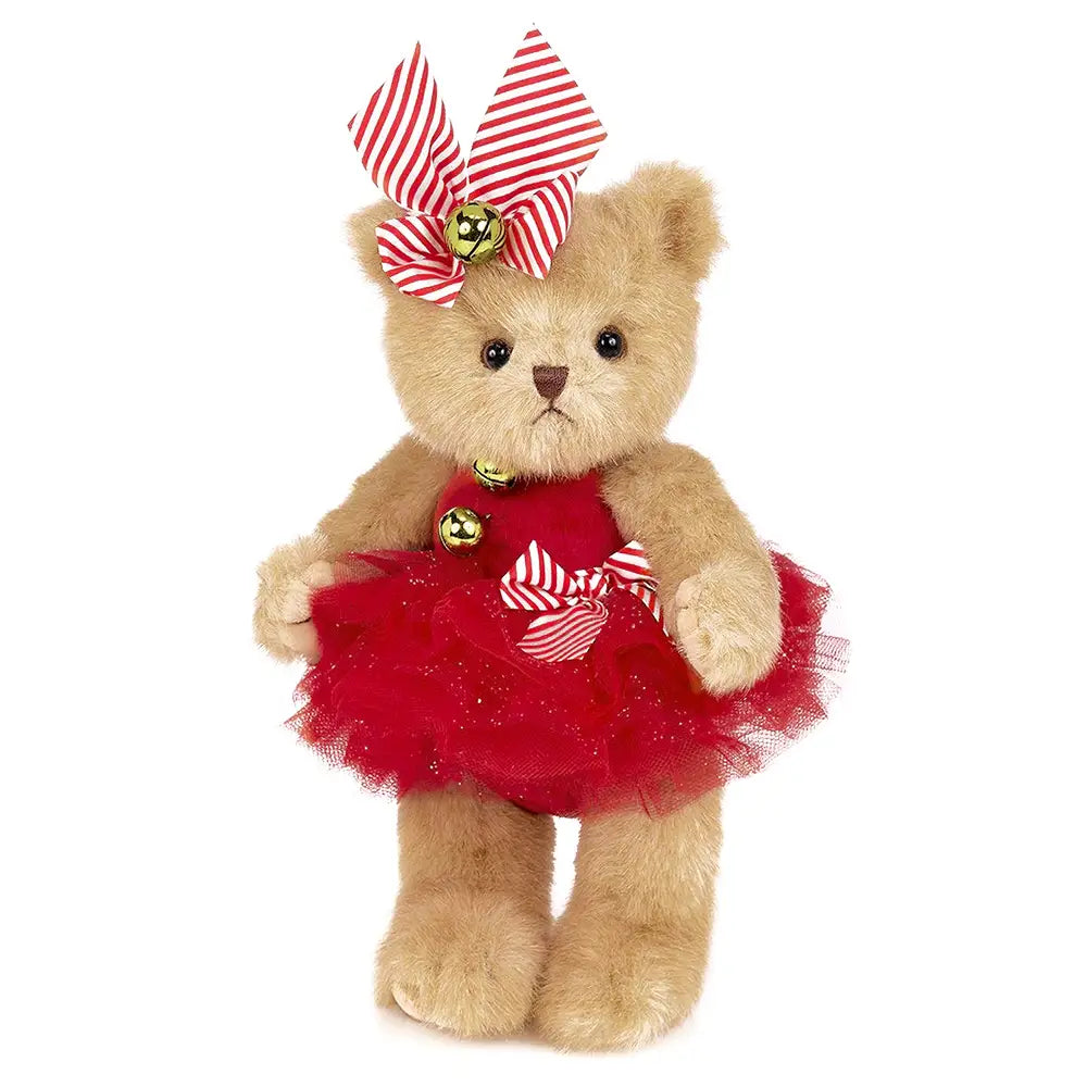 Teddy bear wearing a red dress with a striped bow on a white background