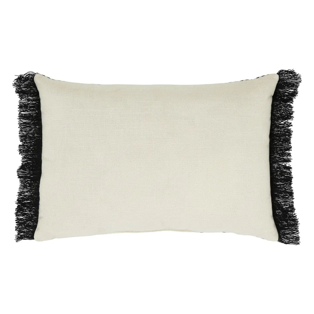 Beige pillow with black fringe on a white background