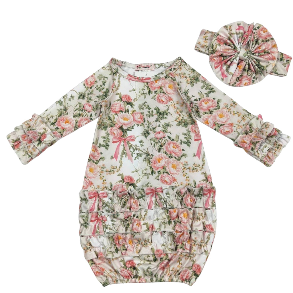 Floral baby gown with matching headband on a white background