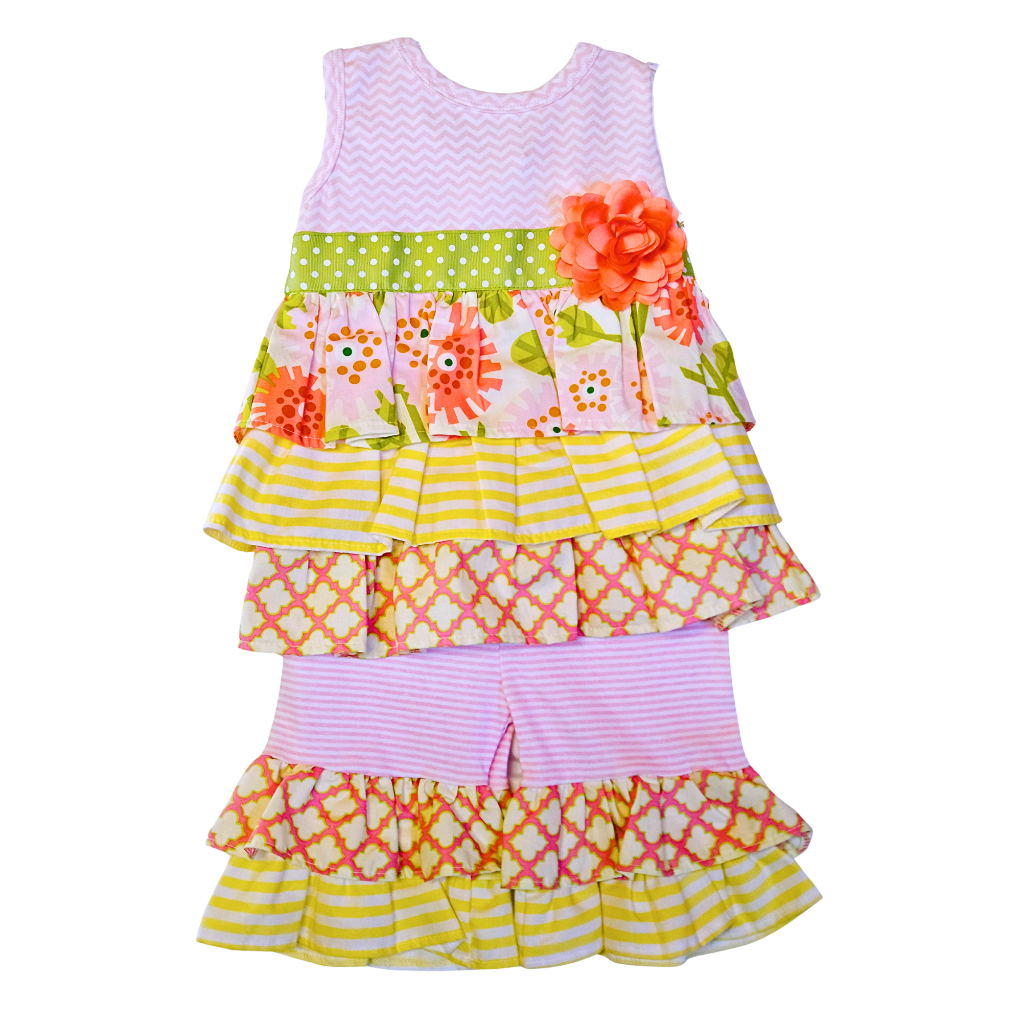 Colorful children's dress with floral and geometric patterns on a white background
