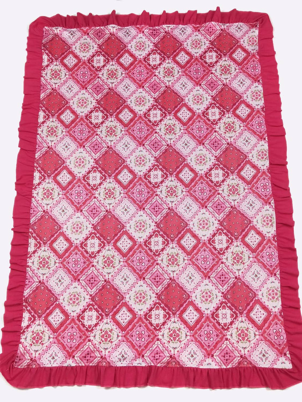 Pink and white patterned blanket with ruffled edges on a white background