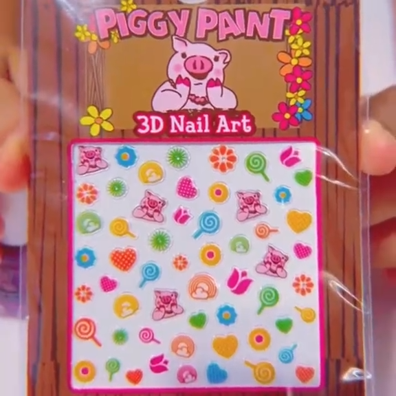 Piggy Paint 3D Nail Art kit with colorful designs in a clear packaging